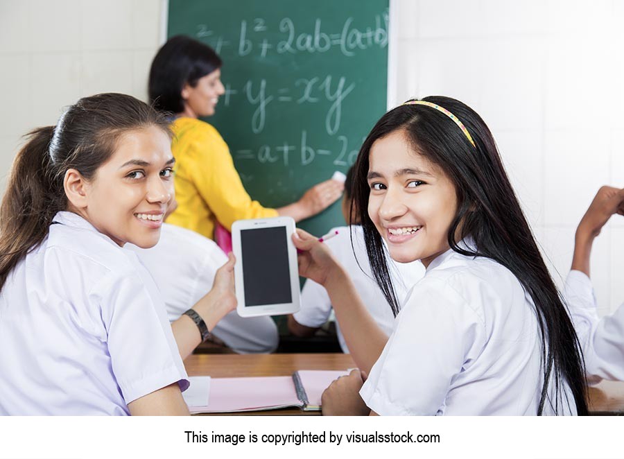 School Girls Classroom Using Tablet