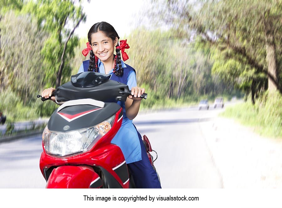 School Girl Riding Scooty