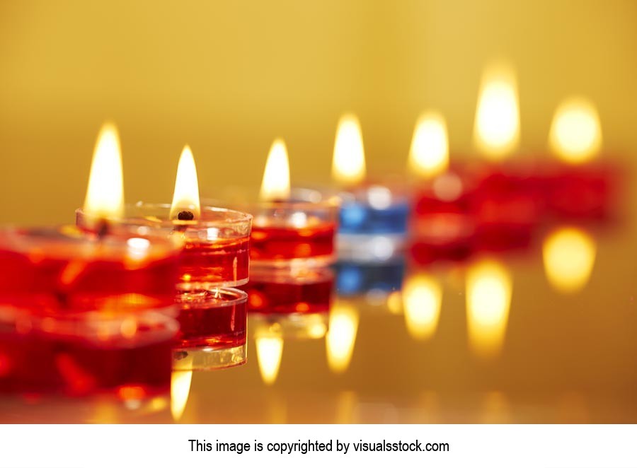 Arranging ; Burning ; Candlelight ; Candles ; Cele