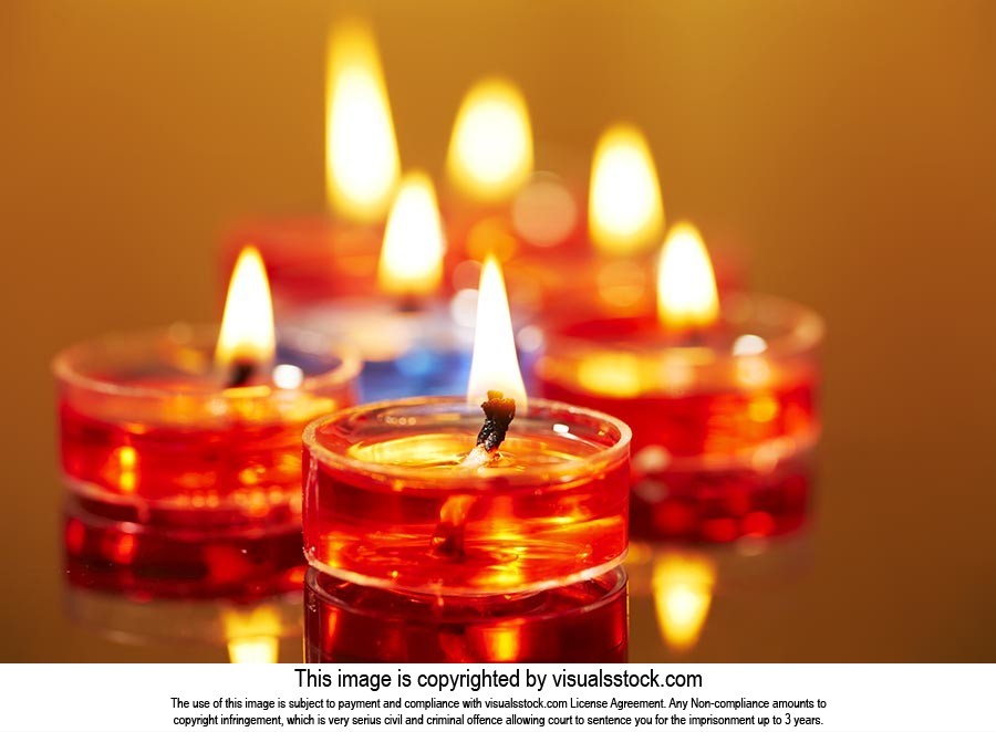 Arranging ; Burning ; Candlelight ; Candles ; Cele