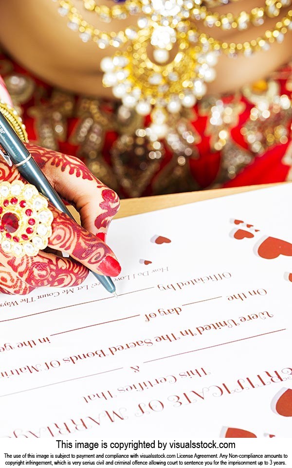 Bride Signing Marriage Certificate