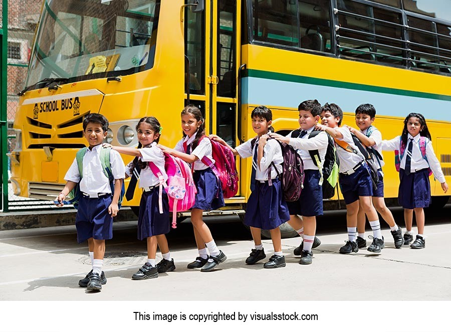 Bag ; Boys ; Buildings ; Bus ; Carefree ; Carrying