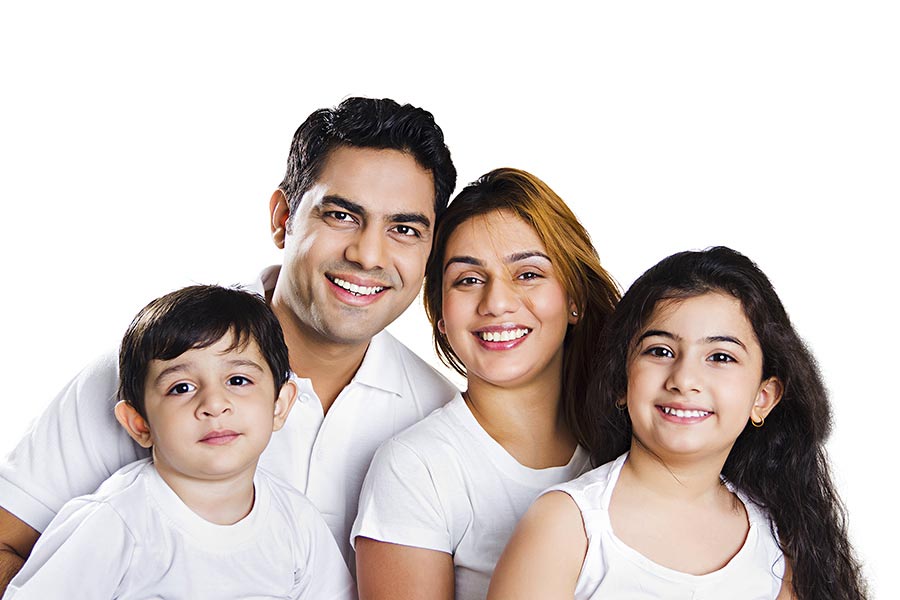 Indian Family Parents And Kids Sitting Together Smiling White background