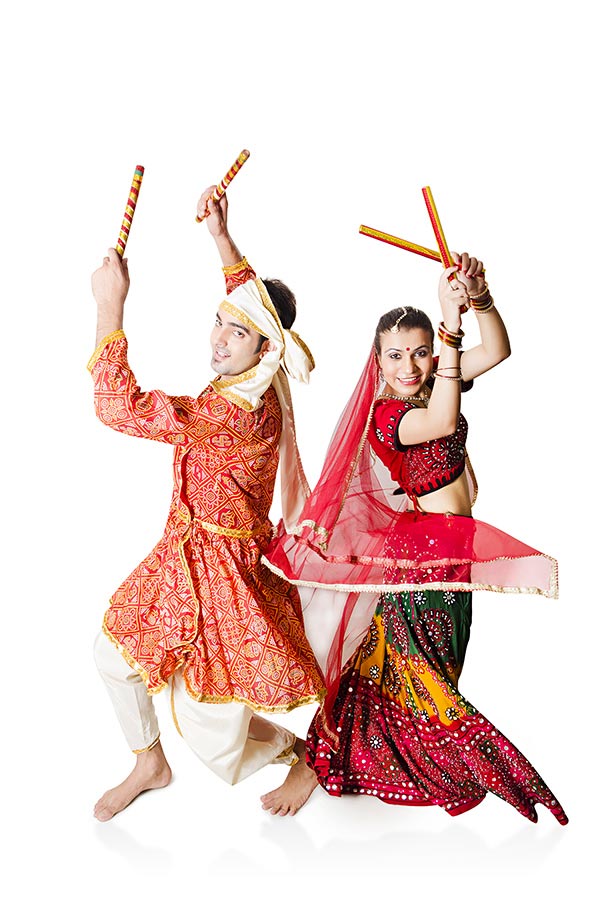 Gujarati Couple Dancer Dancing with dandiya sticks Garbadance on