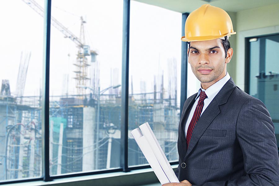 Man Architect OrEngineer Holding Blueprints RealEstate Project In