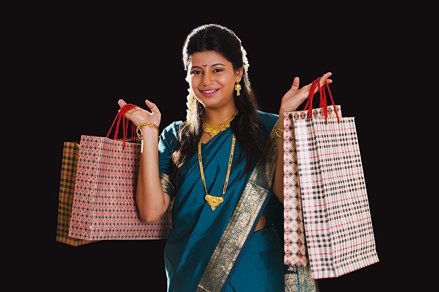 Traditional indian Marathi woman holding shopping bags ondiwali Festival