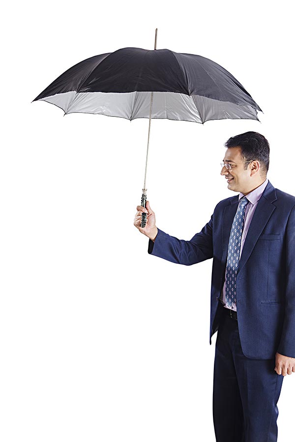 Indian MIdAdult Business Man Giving Umbrella Rain Protection