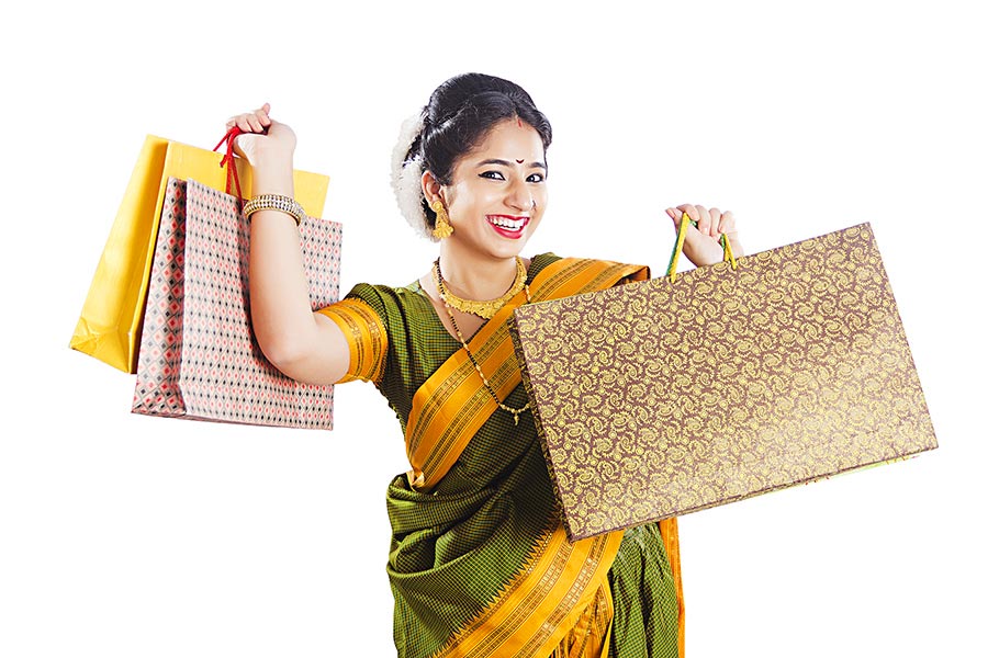 Indian Marathi Woman inTraditional Saree Carrying colorful shopping