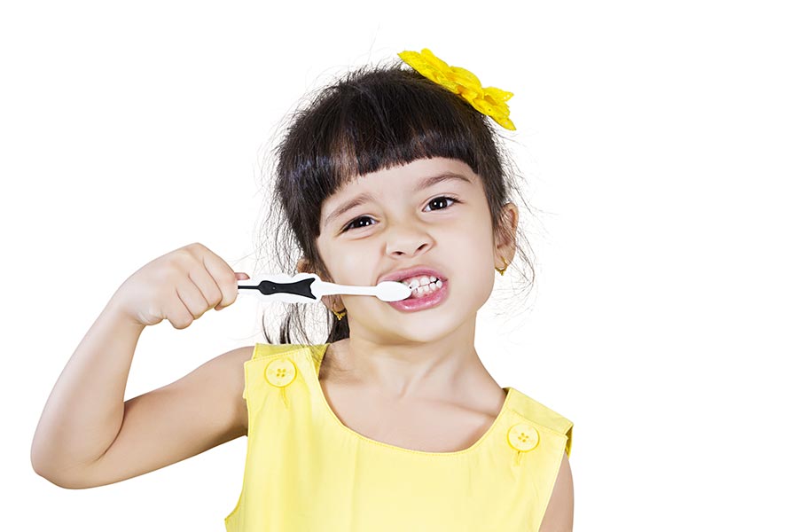 Cute littlegirl brushing her teeth She uses toothbrush conceptof healthy