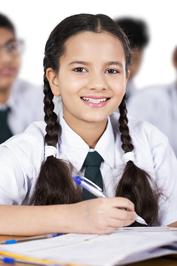 Indian Elementary-School Teenage-Girl Student Studying Writing In