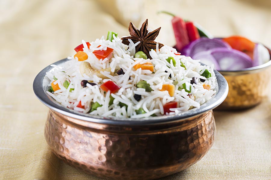 Cooked Indian basmati rice bowl Serving Table Lunch InRestaurant Nobody