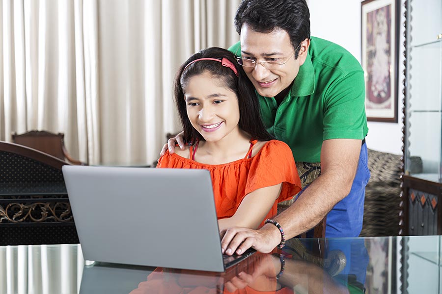 Indian Father Teaching Helps Daughter Laptop Studying ELearni