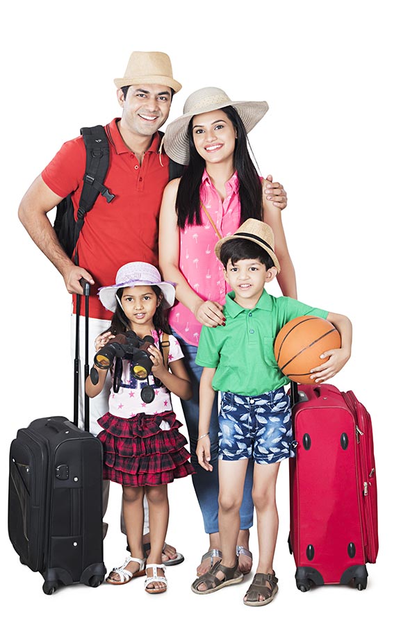 Happy Indian Family Parents And Kids Standing With Suitcase Holiday