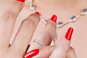 Woman Putting Diamond Ring Jewellery Part Of