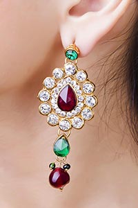 woman wearing shiny diamond earrings