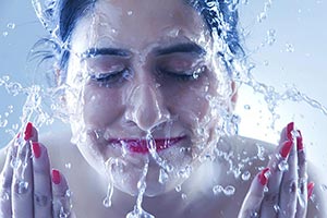 Beautiful Woman Bath Washing Clean face water Spla