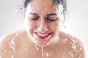 Beautiful woman washing Cleaning face water