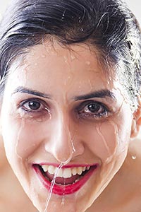 Close-up Beautiful wet woman face water drop