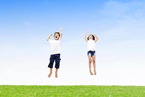 2 People ; Arms Raised ; Barefoot ; Boys ; Brother