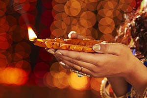 Woman Hand Holding Diwali Diya