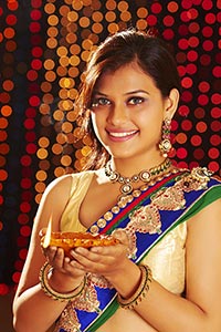 Lady Holding Diya Celebrating Diwali