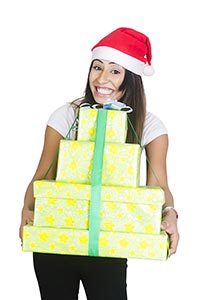 Woman Wrapped gift box Showing Christmas Celebrati