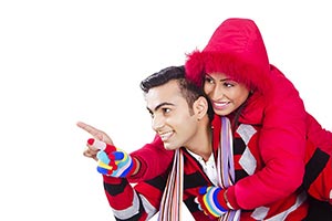 Indian Happy couple winter piggyback Pointing Show