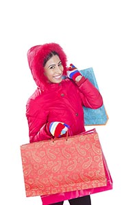 retail and sale concept happy woman winter clothes