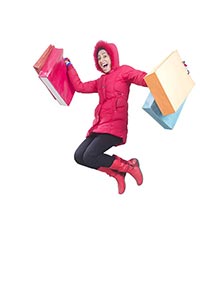 Excited woman Winter Clothes jumping with her shop