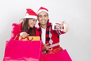 Couple Christmas Winter Shopping Bags Taking Selfi