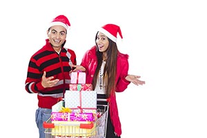 Excited Couple christmas shopping gift Trolley Fun