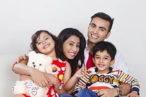 Indian Family Sitting Sofa Enjoy Smiling