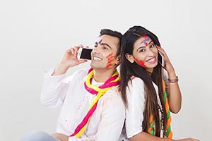 Couple Holi Celebrating Enjoy Talking Phone Smilin