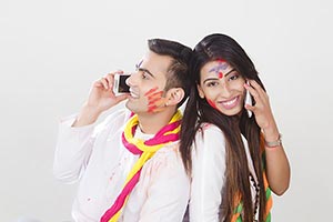 Happy Couple Holi Celebrating Talking Cellphone