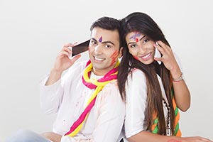 Couple Holi Festival Celebrating Talking Cellphone