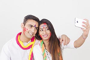 Couple Holi Celebrating Enjoy Taking Phone Selfie