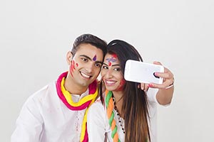 Couple Holi Celebrating Enjoying Taking Phone Self