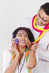 Couple Holi Celebration Enjoying applying Colour R