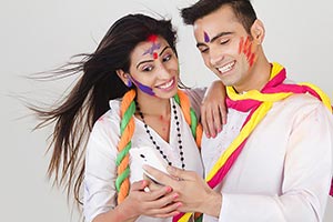 Couple Holi Celebrating Enjoying Reading Messaging