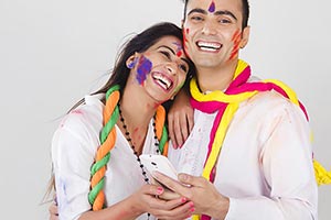 Indian Couple Holi Celebrating Fun Chatting Phone