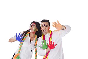 Excited Couple showing colored hands Holi Celebrat