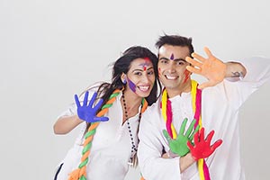 Couple showing colored hands Holi Celebrating Fun