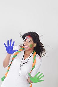 Indian Woman showing colourful palm celebrating ho