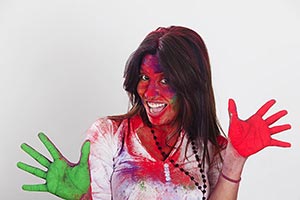 Man showing colourful palm celebrating holi Fun Ch