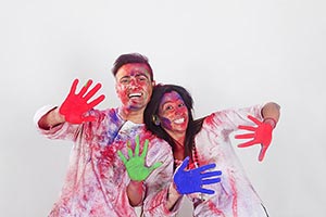 Couple showing colored hands Holi Celebrating Fun