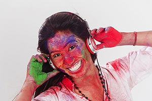 Woman Holi Celebration listening music headphone F