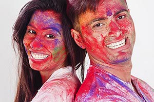 Holi Couple Celebrating Back To Back Smiling Colou