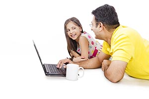 Father Daughter Working Laptop Lying Floor