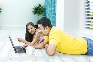 Father Daughter Watching Laptop Pointing