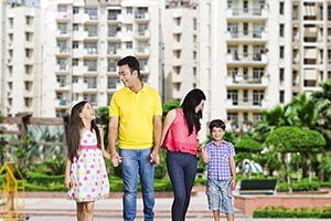 Indian Parents Standing Outside Apartment